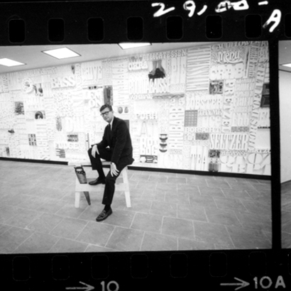 Lou Dorfsman sits in front of the completed Gastrotypographicalassemblage.